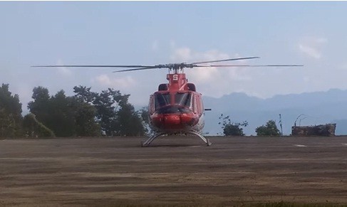 In this screenshot from a YouTube video, a helicopter run by Nagaland State Transport is seen landing in Mokohchung. (Screenshot: Unusual Production/YouTube)